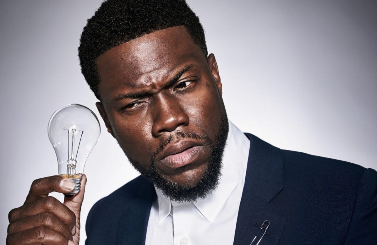 Kevin Hart with a lightbulb next to his ear