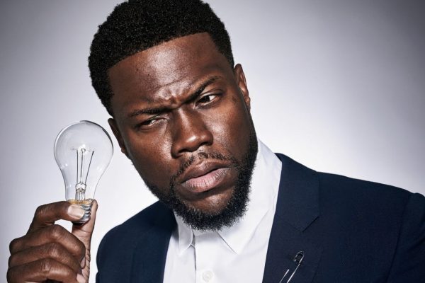 Kevin Hart with a lightbulb next to his ear