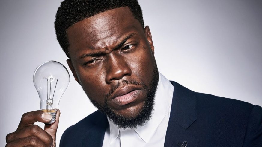 Kevin Hart with a lightbulb next to his ear